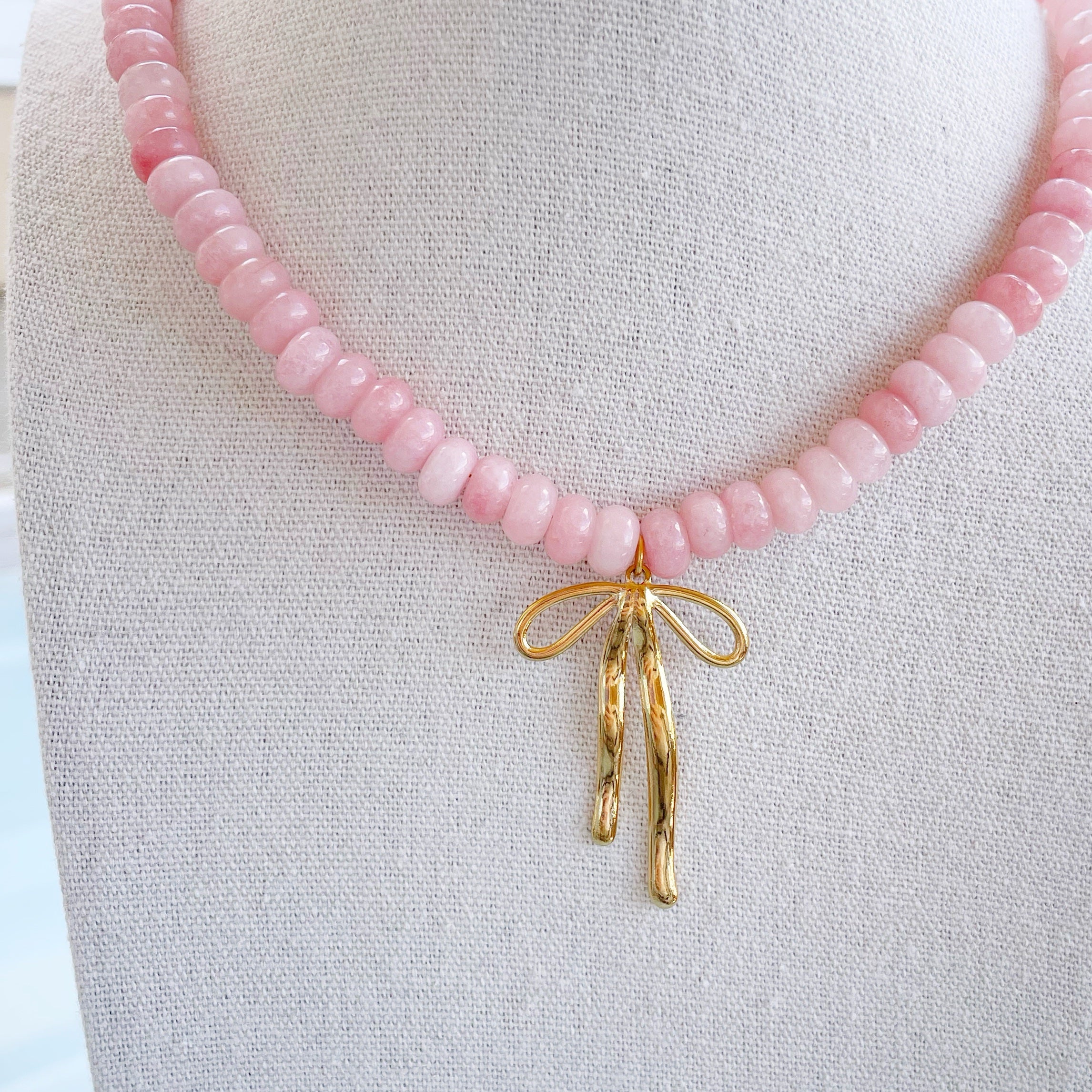 Collar piedras “Lazo” rosa