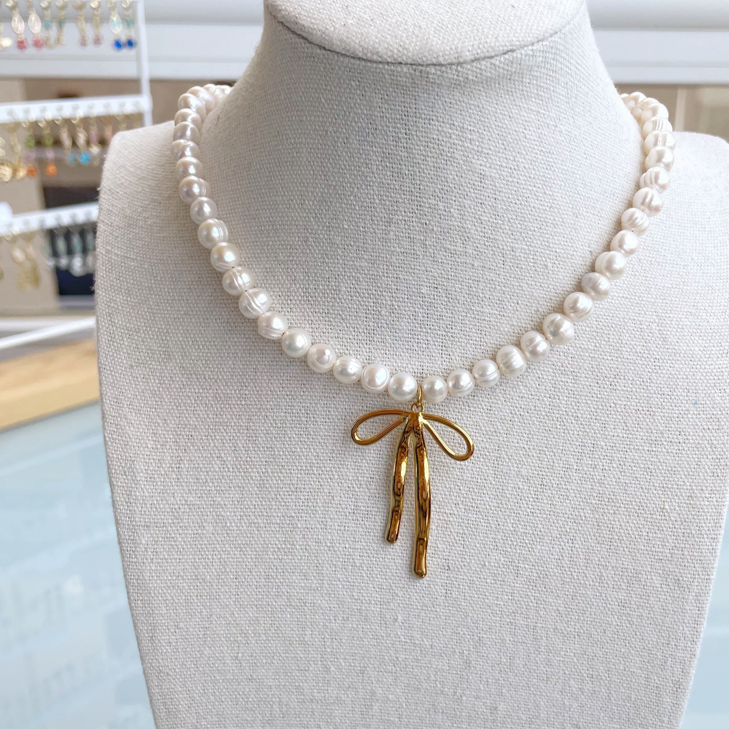 Collar perlas “Lazo” dorado